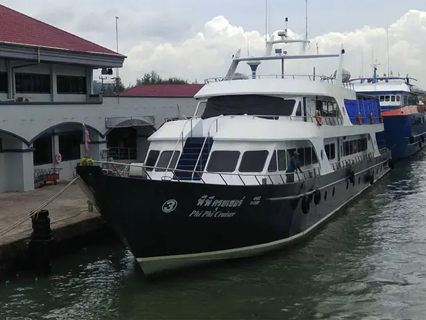 The large Phi Phi Cruiser passenger ferry docked at the Rassada Pier terminal in Phuket, ready for departure